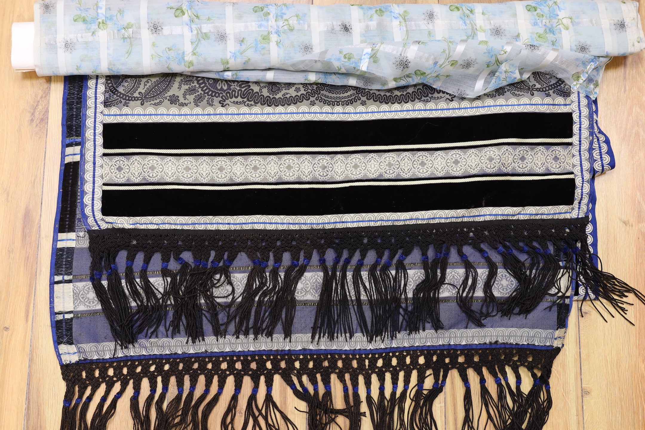 An early Victorian silk and velvet ladies stole, a length of finely woven silk with a woven check design and floral overprint, and a 19th century kerchief printed with scenes from the Isle of Man